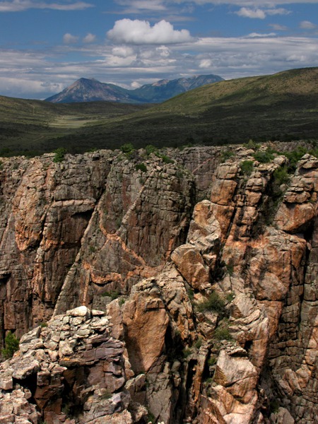 Pegmatite Dikes With Mountain Background